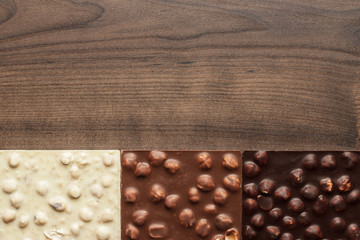 different chocolate bars with whole hazelnuts