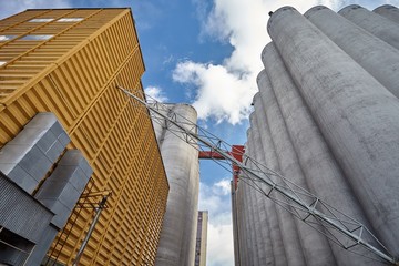 Factory exterior with grain silos © Teemu Tretjakov