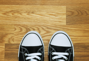 Canvas shoes on wooden floor
