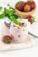 Strawberry yogurt  with fresh fruits and mint leaves