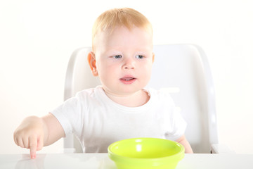 child is sitting at the table