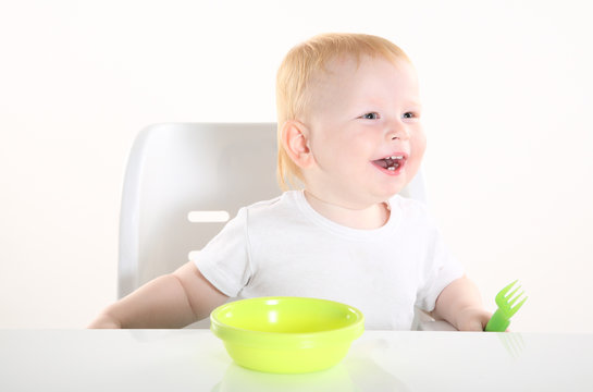 child is sitting at the table