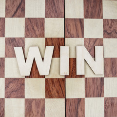 win concept on wooden background