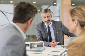 Architect meeting with clients in office