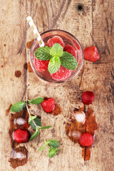 strawberry drinks on wood background