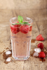 strawberry drinks on wood background