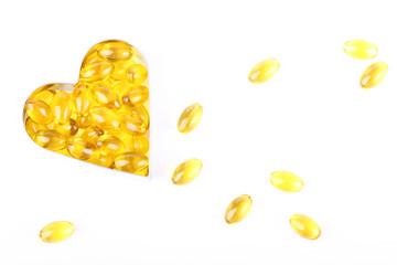 vitamin capsules in figure of heart