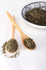 Fototapeta na wymiar Green tea on wooden spoon