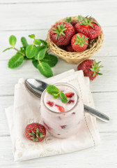 Strawberry yogurt  with fresh fruits and mint leaves