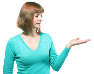 Fototapeta premium beautiful red-haired girl holding something on her hand