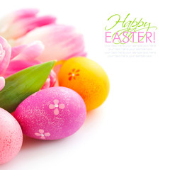 Easter eggs with pink tulip flowers on white background