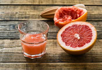 Glass of fresh organic pink grapefruit juice