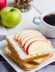 sandwich with curd cheese, apple, honey and dried fruits, coffee