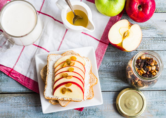 bran toast with cheese, apple and dried fruits, healthy breakfas