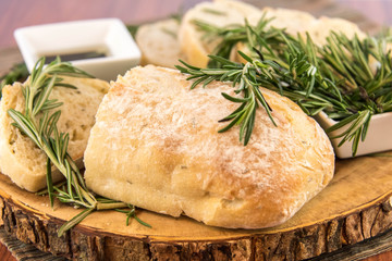 fresh baked resomary bread loaf and olive oil and balsamic vineg