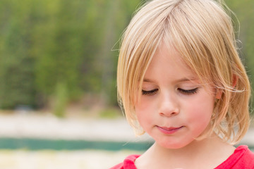 Timid Little Girl Looking Down