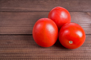 tomatoes on wooden background