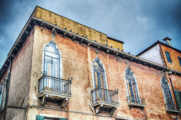 orange building under a cloudy sky in Venice