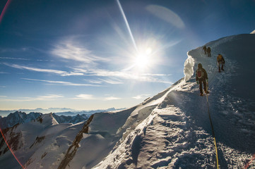 climbers climbing Mont Blanc mountain