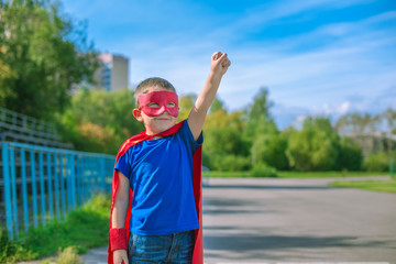 Superhero standing on stadium and calling on forward