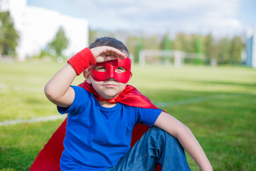 Naklejka premium Superhero looking from under his hand
