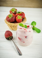 Strawberry yogurt  with fresh fruits and mint leaves