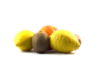 kiwi, lemon and orange, side view, the isolated white background