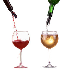 Red white wine in glass pouring from bottle splash
