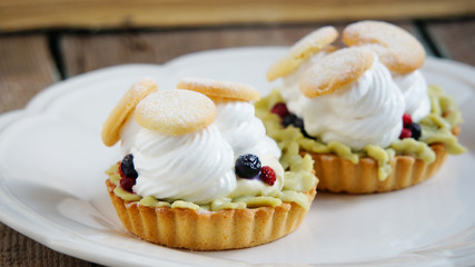 tartlets with cream, tea matcha curd and whisked egg whites
