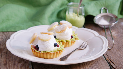 tartlets with cream, tea matcha curd and whisked egg whites
