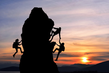 teamwork of two men travelers and girl help on mountain