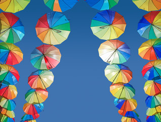 Fototapeta na wymiar Umbrellas coloring the sky 