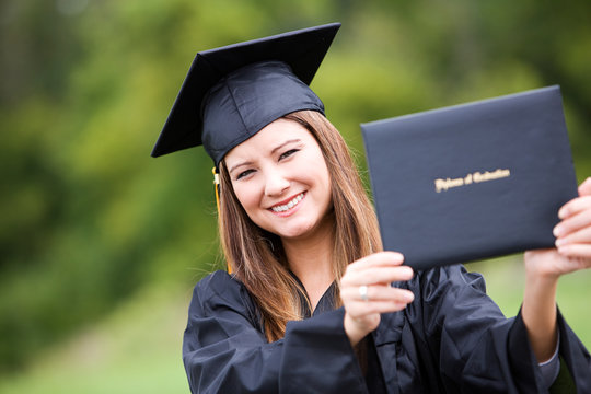 Graduate: Woman Proudly Holding Up Diploma