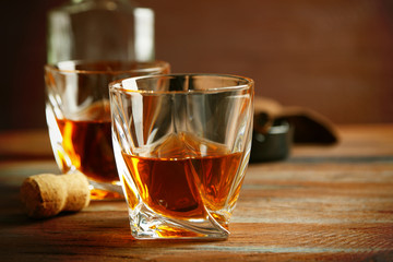 Whiskey on wooden background