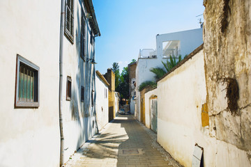 Narrow pedestrian alley between tenement houses