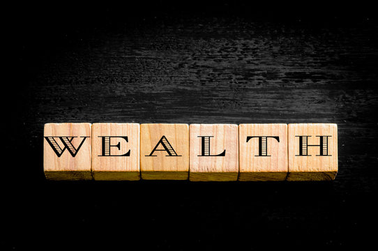 Word Wealth Isolated On Black Background