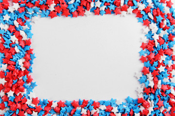 Colorful sprinkles on white background