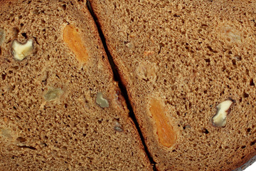 sliced bread dessert with dried apricots, raisins and walnuts