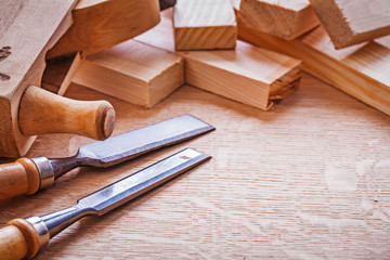 very close up view on chisels old woodworkers plane and stack of