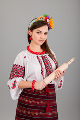 Housewife with rolling pin. Woman wears Ukrainian national dress