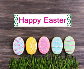 Delicious Easter cookies on wooden background