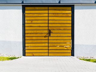 Yellow wooden door outside.