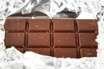 Bar of chocolate in foil, closeup