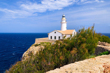 Fototapeta na wymiar Lighthouse built on cliff in Son Mol, Majorca island, Spain