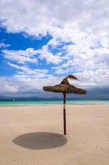 Umbrellas on sandy Alcudia beach, Majorca island, Spain