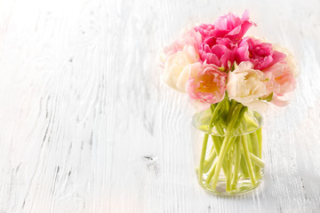 Bouquet of fresh tulips on wooden background