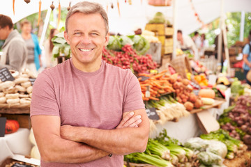 Male Stall Holder At Farmers Fresh Food Market