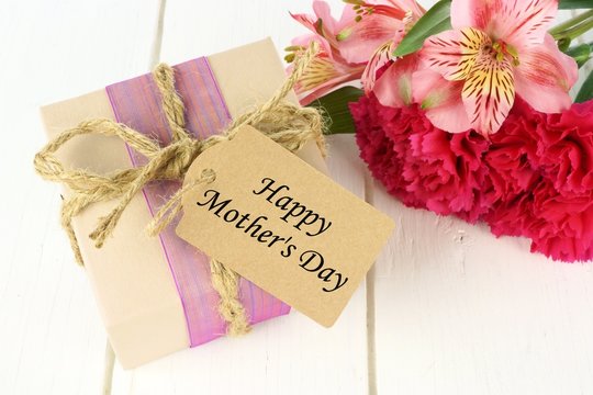 Gift box with Happy Mother's Day tag and pink flowers