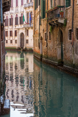 Fototapeta na wymiar Romantic narrow canal in center of Venice.