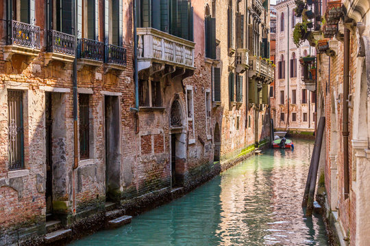 Romantic narrow canal in center of Venice.